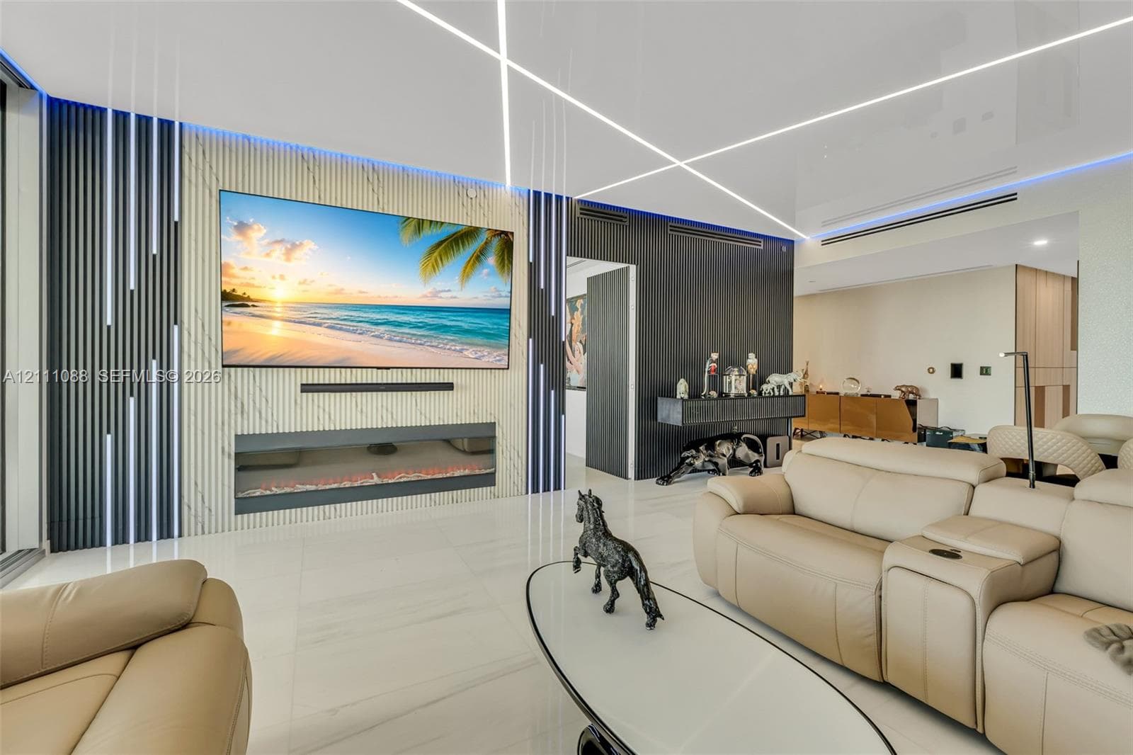 Feature wall with stone-finish cladding and integrated linear lighting, flush-mounted electric fireplace, vertical slat accent detailing, and large-format porcelain tile flooring