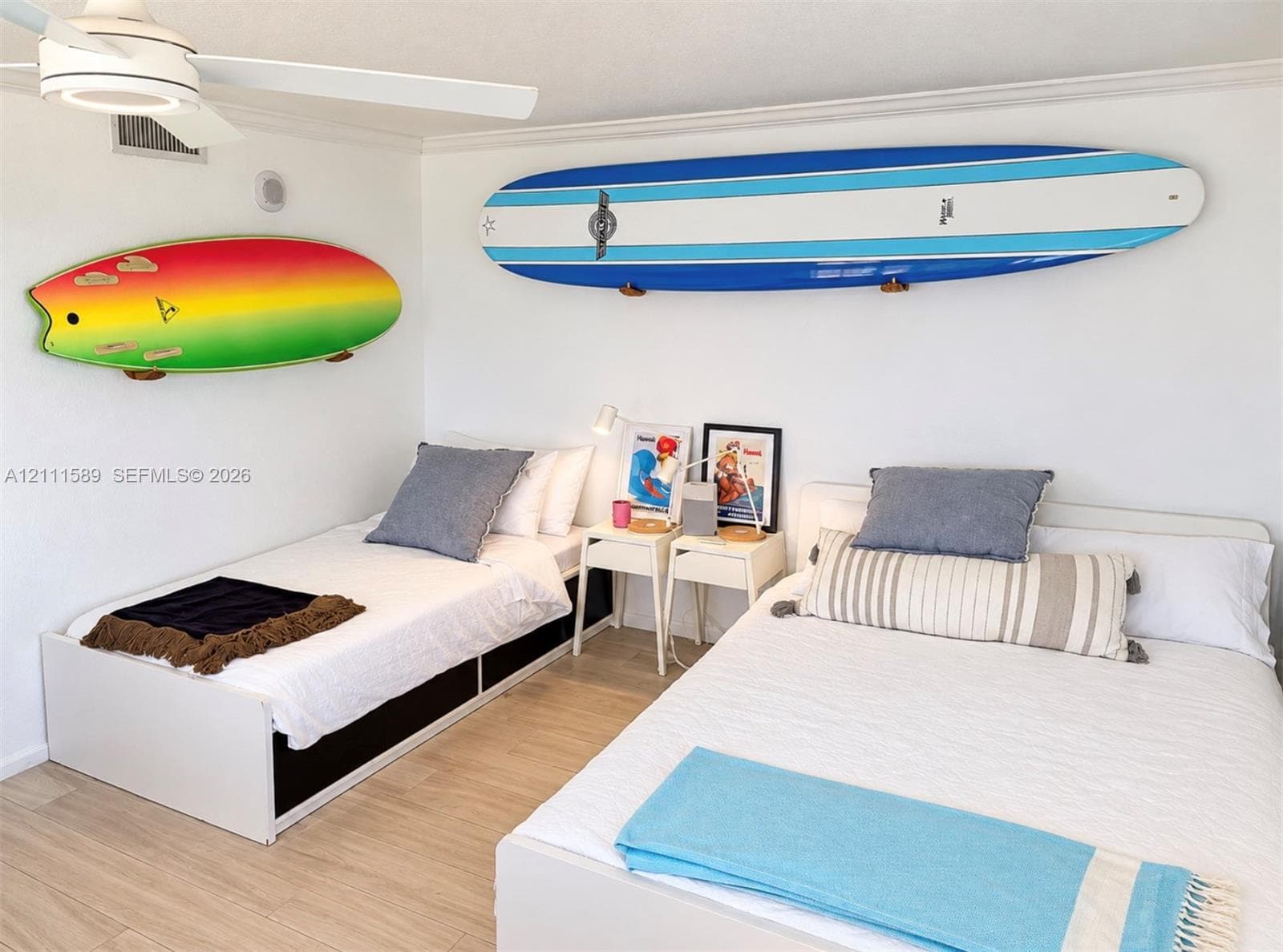 Wood-finish flooring and ceiling-mounted light fixture with integrated fan