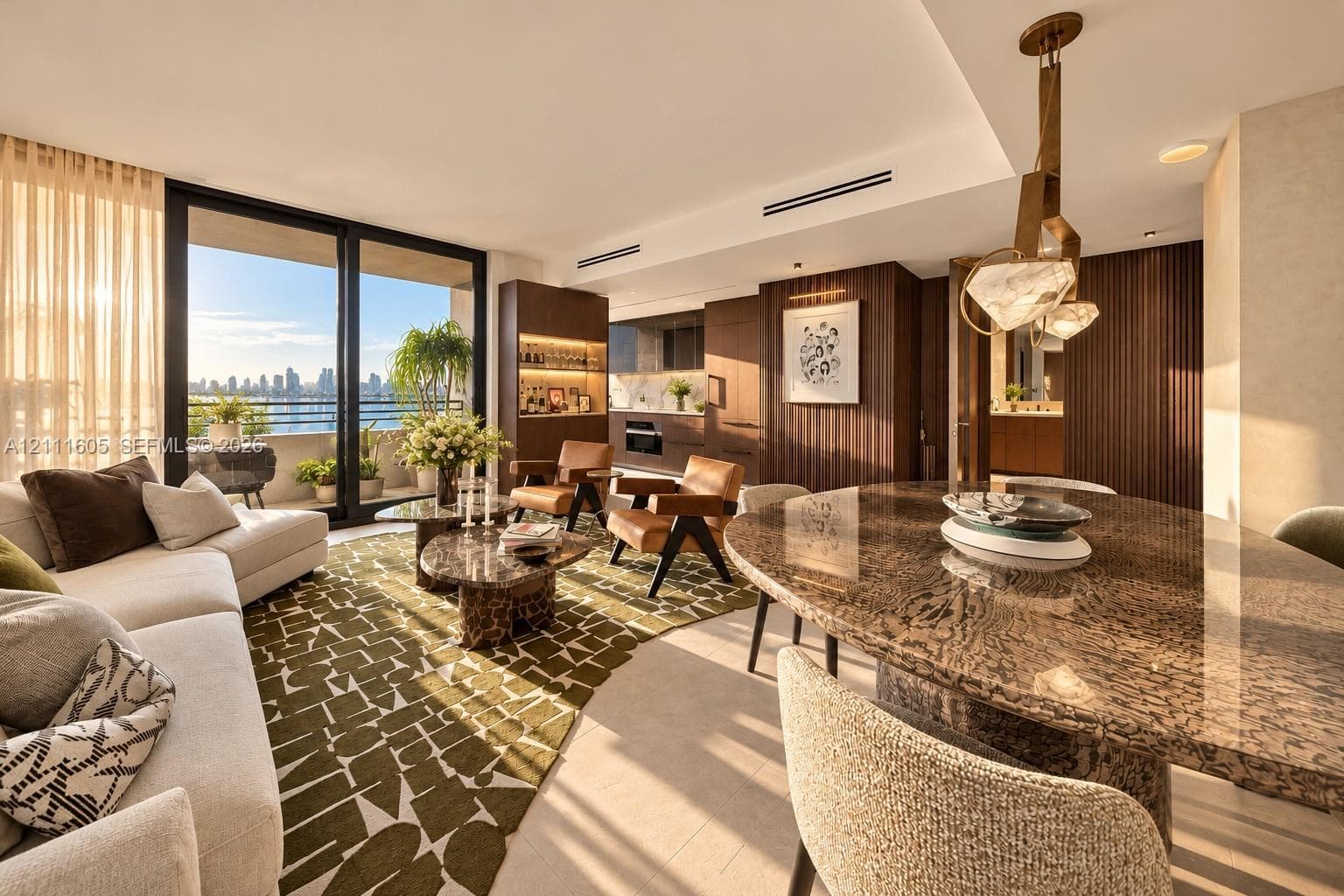 Open-concept floor plan featuring floor-to-ceiling glass sliding doors, recessed linear lighting, custom dark wood-finish cabinetry, and a geometric pendant light fixture
