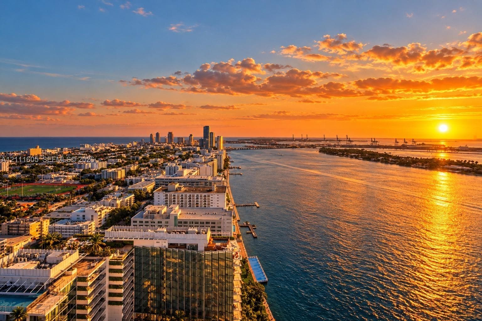 Aerial perspective featuring urban skyline, waterfront positioning, and panoramic water scenery