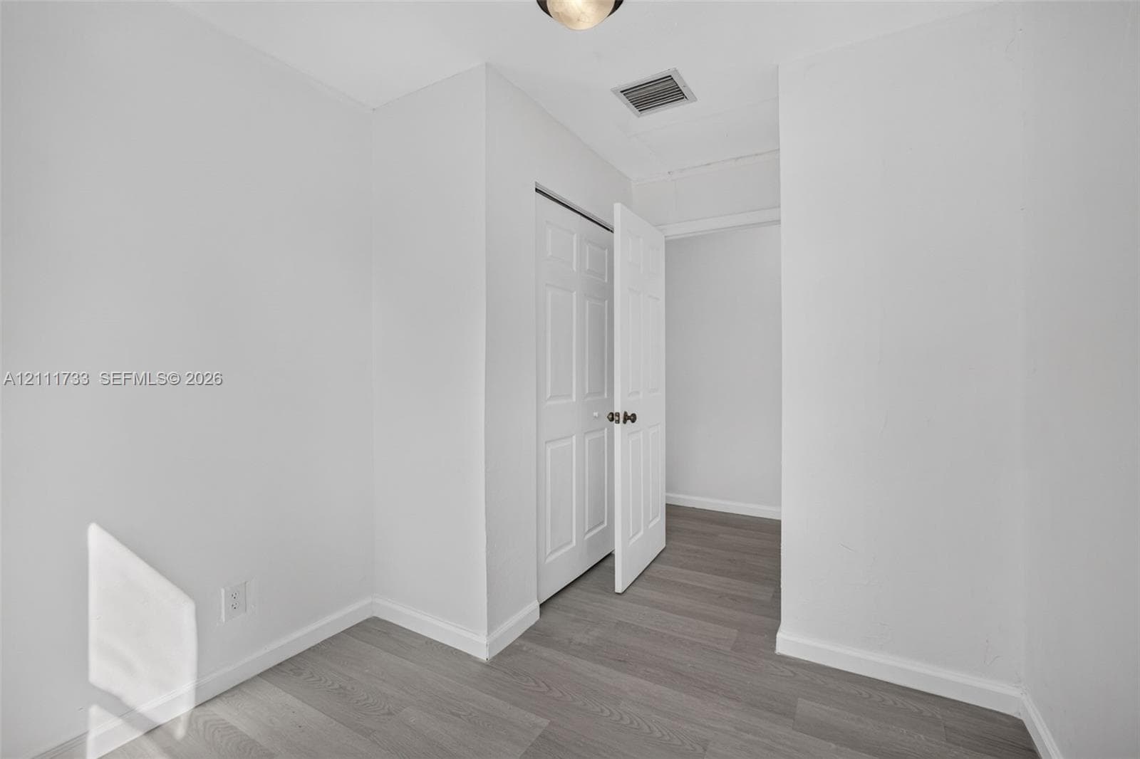 Rear bedroom entranceway with Lock-off door to front of house