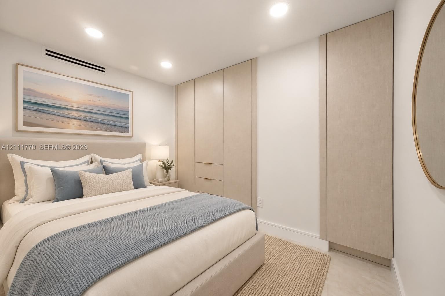 Built-in floor-to-ceiling cabinetry with integrated hardware, recessed ceiling lighting, and smooth-finish interior walls