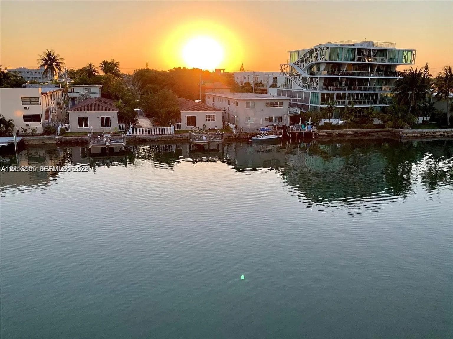 Waterfront location with direct canal access, private docks, and tropical landscaping