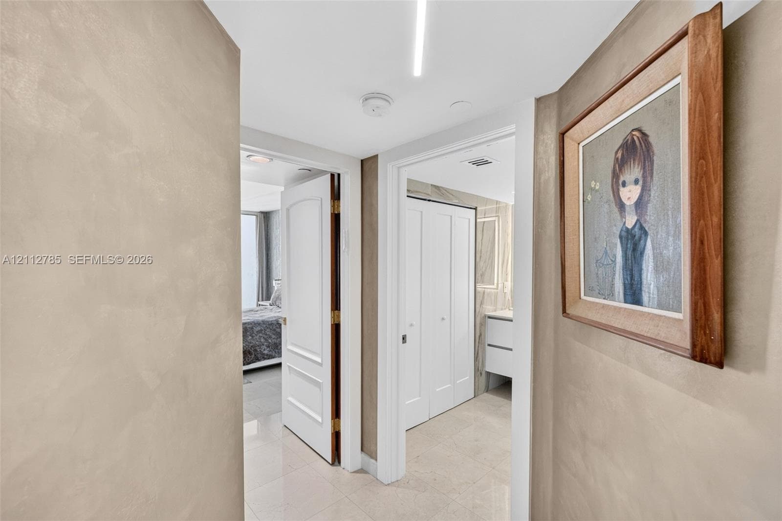Textured wall finish, tile flooring, and solid core doors featuring recessed panels