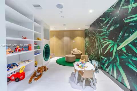 Built-in white shelving, integrated circular wall accent, wood-paneled feature wall, and botanical-patterned wallpaper