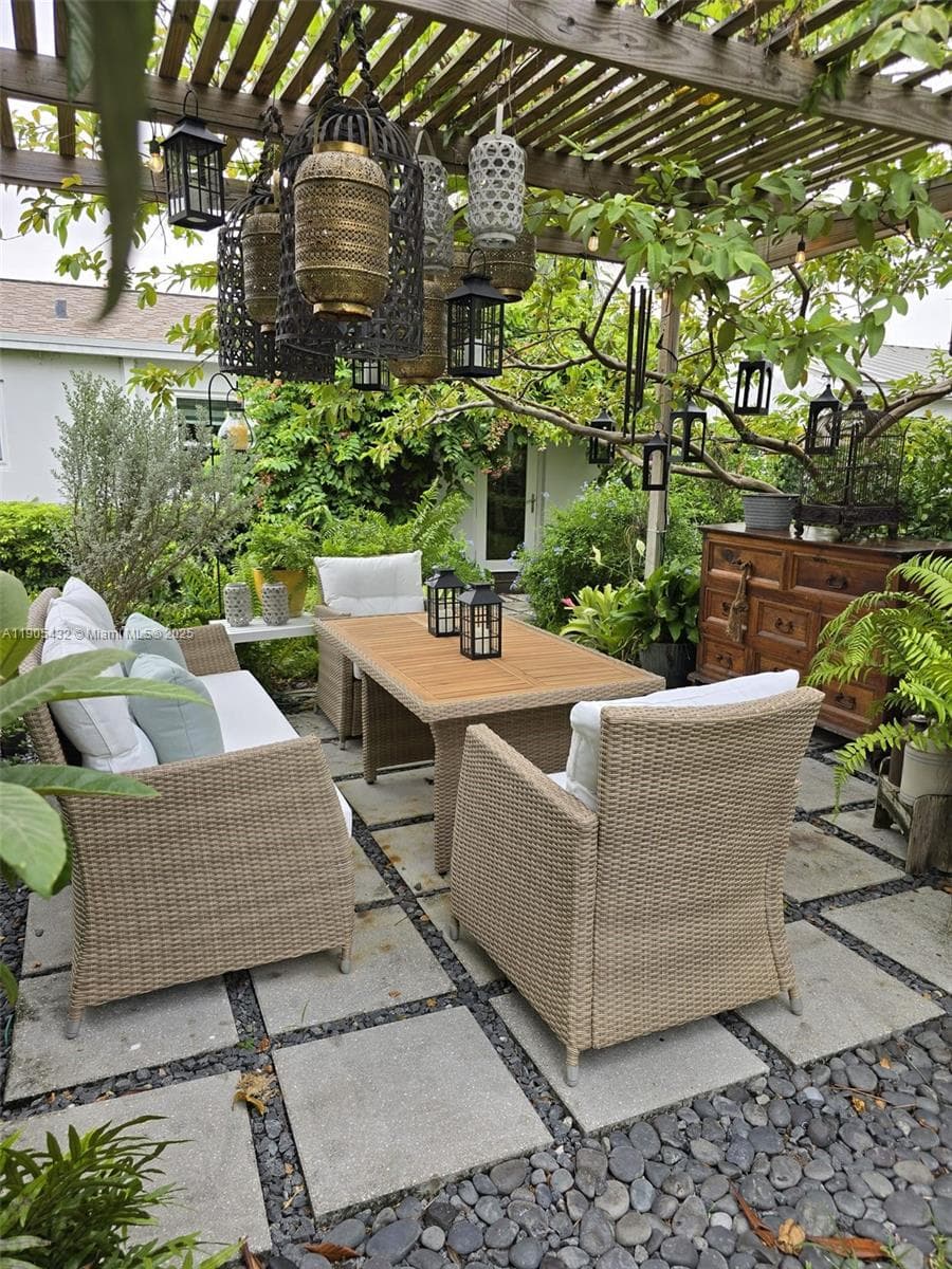 Cozy patio to entertain with a pergola, a stock tank pool, an outside shower and plenty of space to enjoy the lush landscaping.