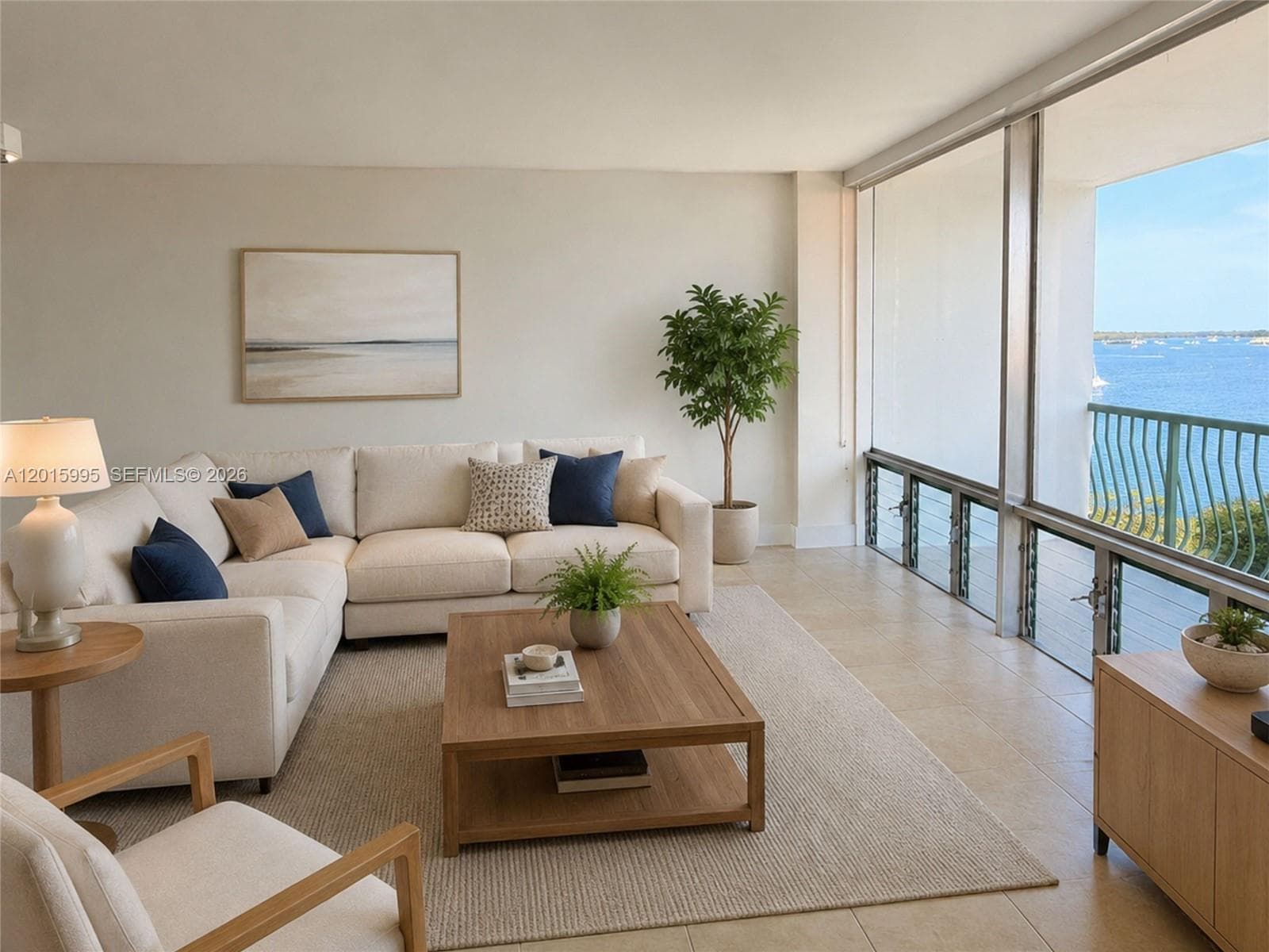 Spacious living room with access to a large balcony offering incredible bay views. -Virtually Staged furniture