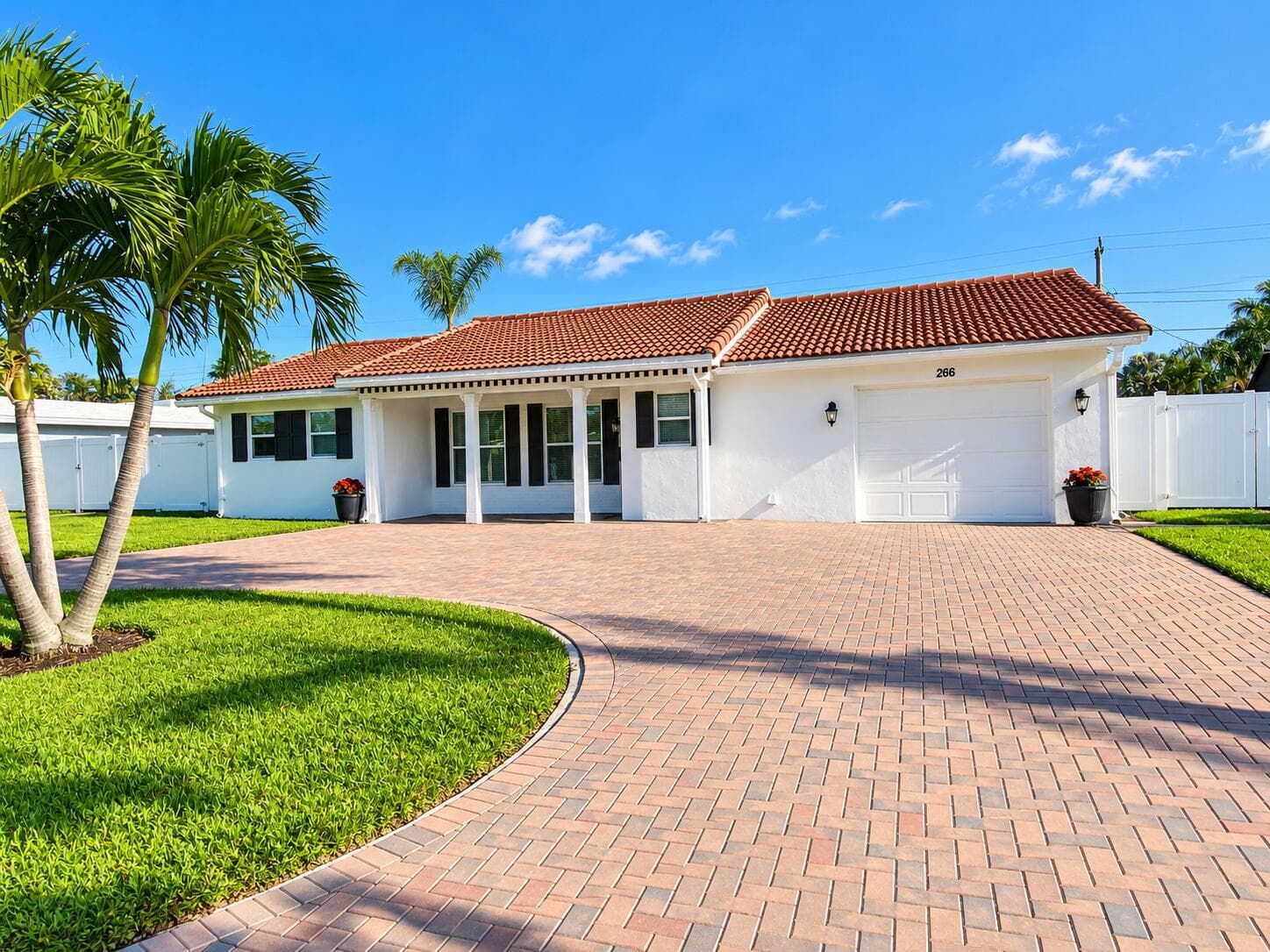 0Sunny Palm-Framed Suburban Home