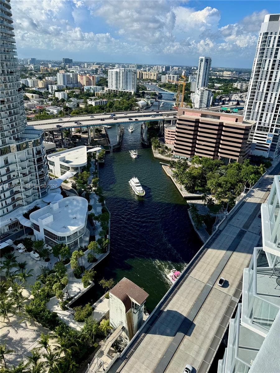 High-rise perspective featuring an urban cityscape with waterway access and multi-story high-rise architecture